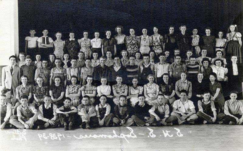 Jean's Sophomore Class in High School | Jean poses for a group picture with her high school class. Jean is 2nd in the 2nd row, getting tickled by a friend. (Courtesy of Jean JENNINGS Bartik Computing Museum)